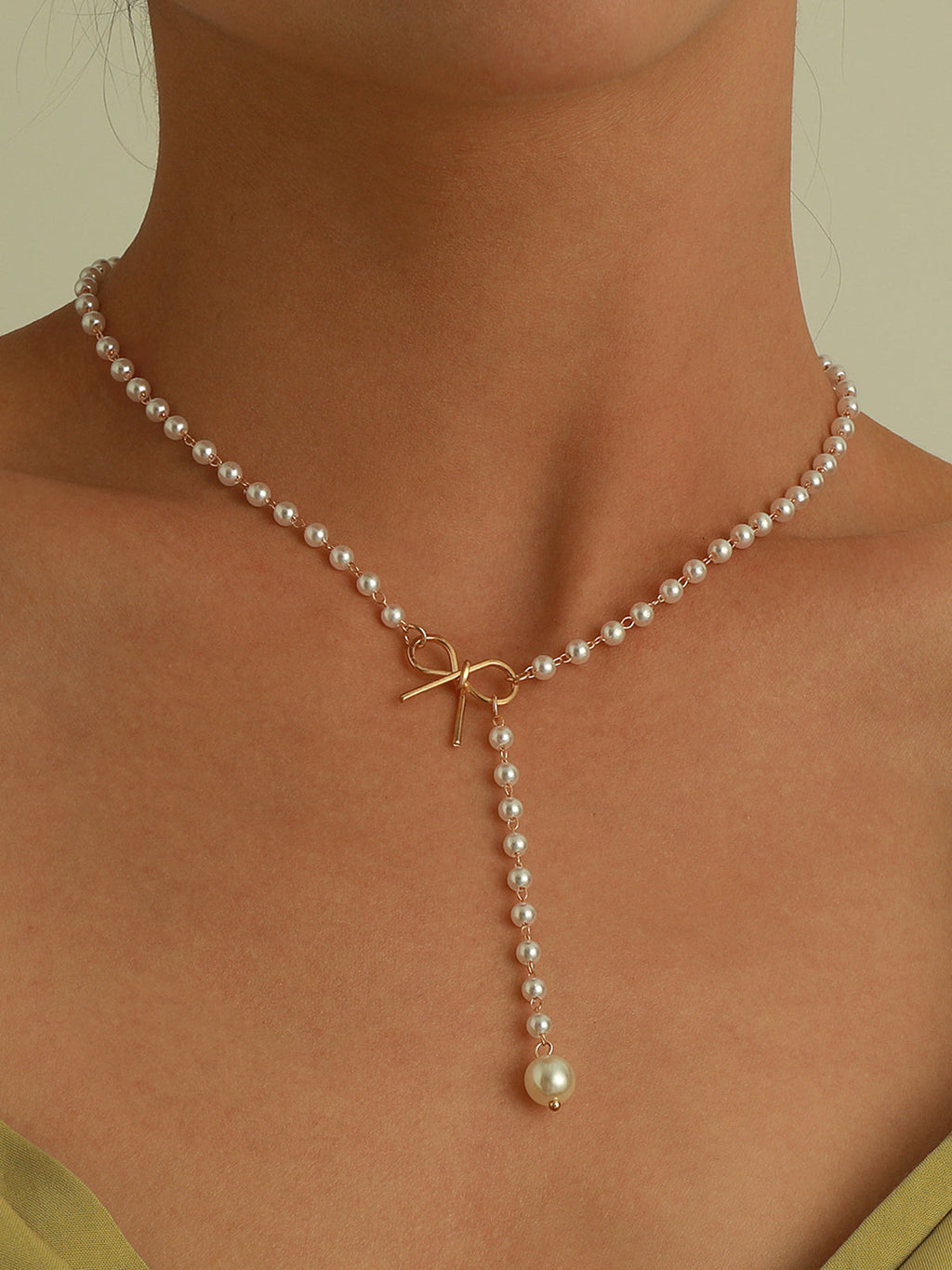 Emma | Exquisite Pearl Bow Necklace with Zirconia Accents 0